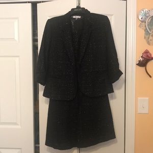 Jennifer Lopez black cocktail dress with jacket.